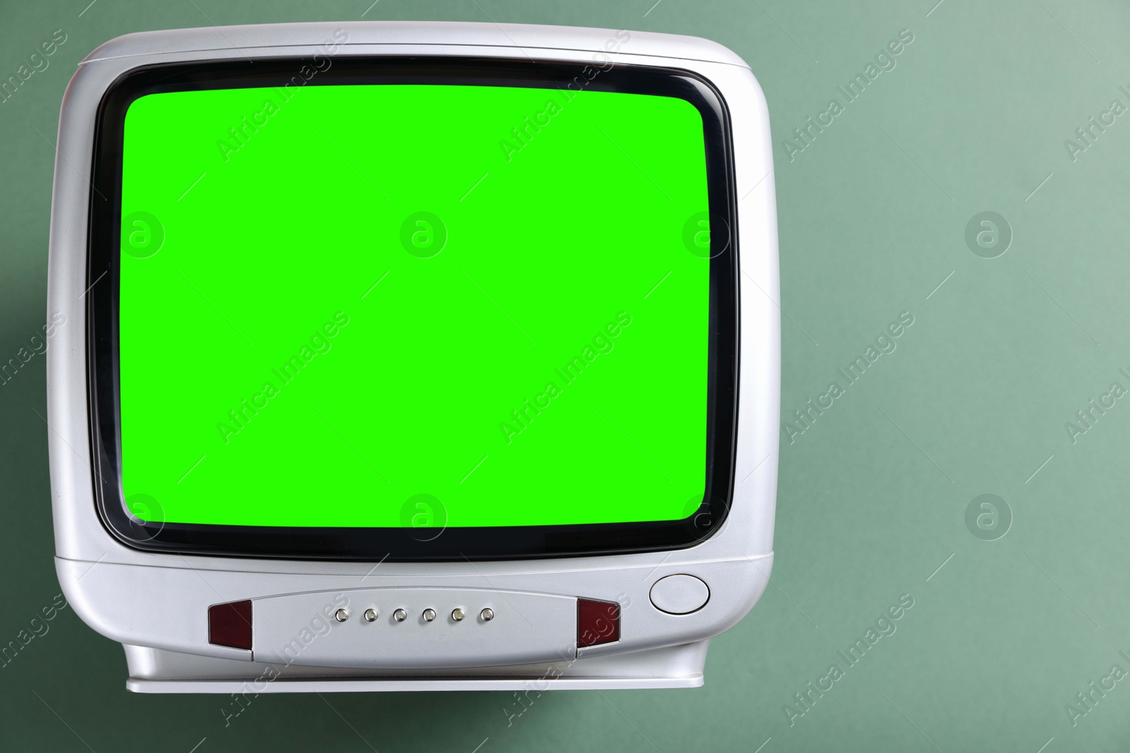 Image of Retro Tv set with green screen on color background, space for design. Chroma key