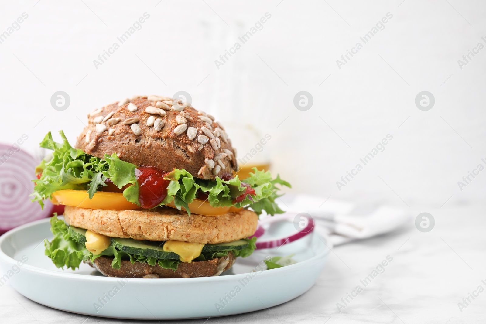 Photo of Delicious vegan burger with chickpea cutlet on white marble table. Space for text