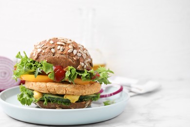 Photo of Delicious vegan burger with chickpea cutlet on white marble table. Space for text