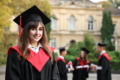 Photo of Graduation ceremony. Happy students outdoors, selective focus