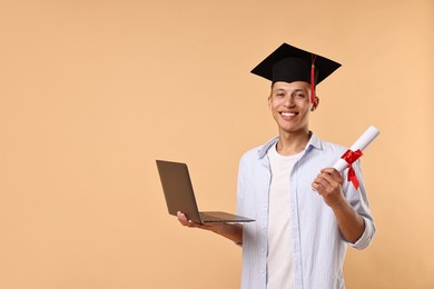 Photo of Happy student with diploma and laptop after graduation on beige background. Space for text