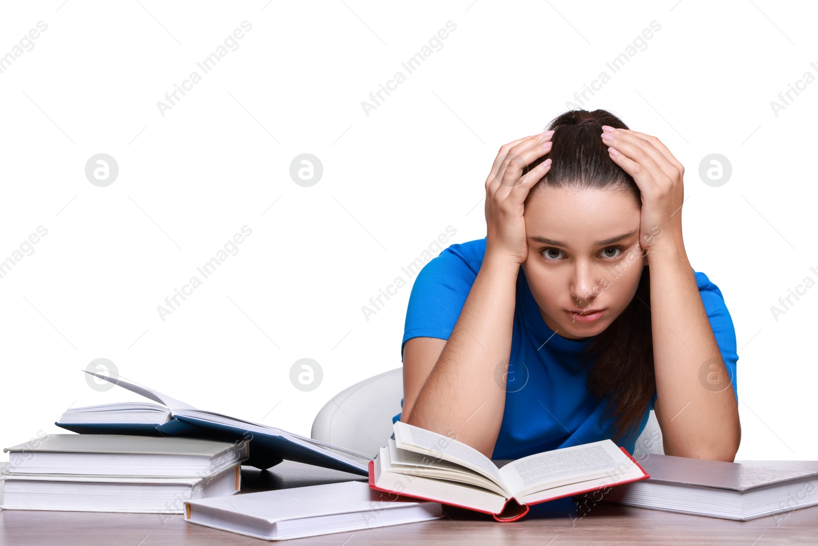 Photo of Young student with books having stress before exam at wooden table isolated on white