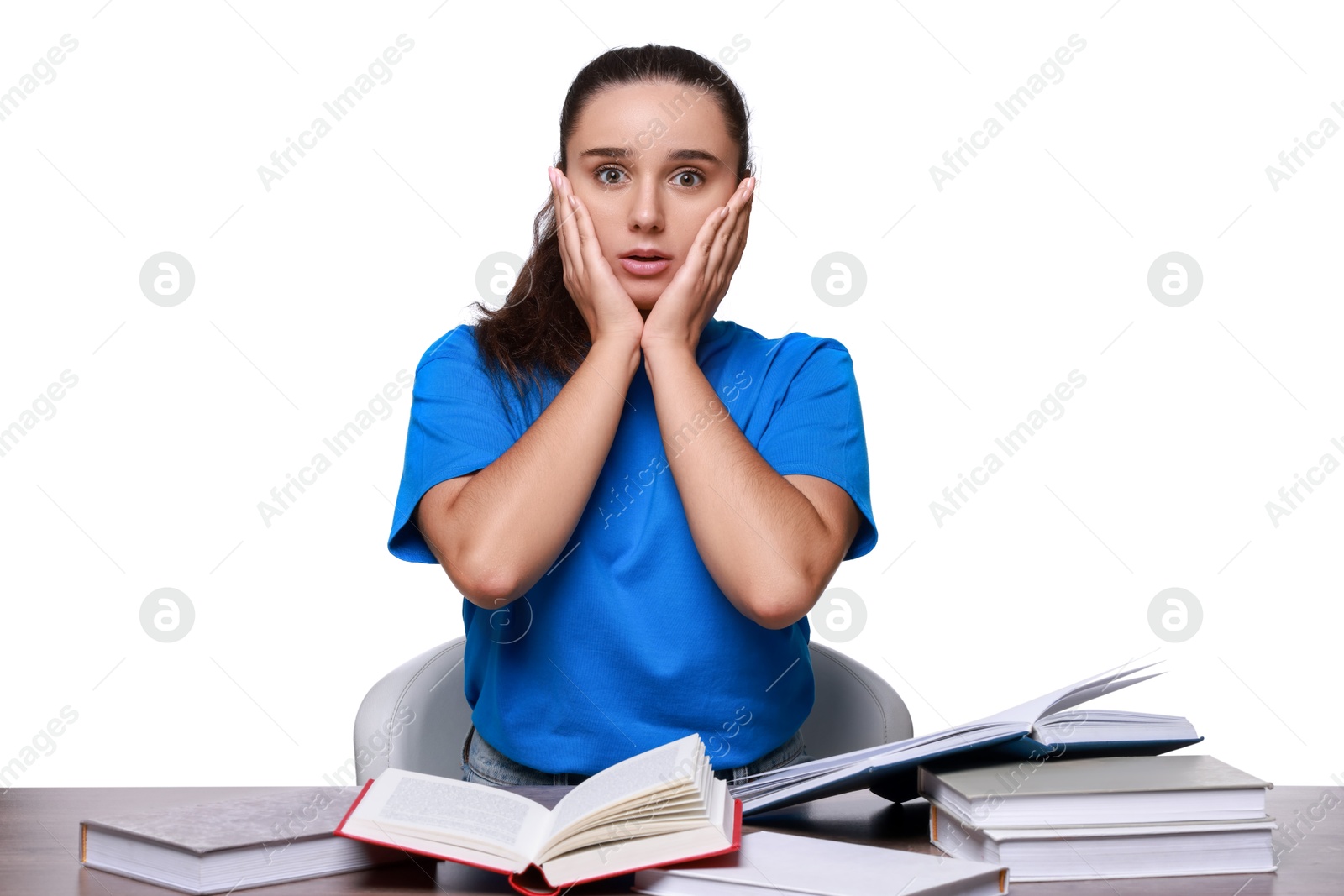 Photo of Young student with books having stress before exam at wooden table isolated on white