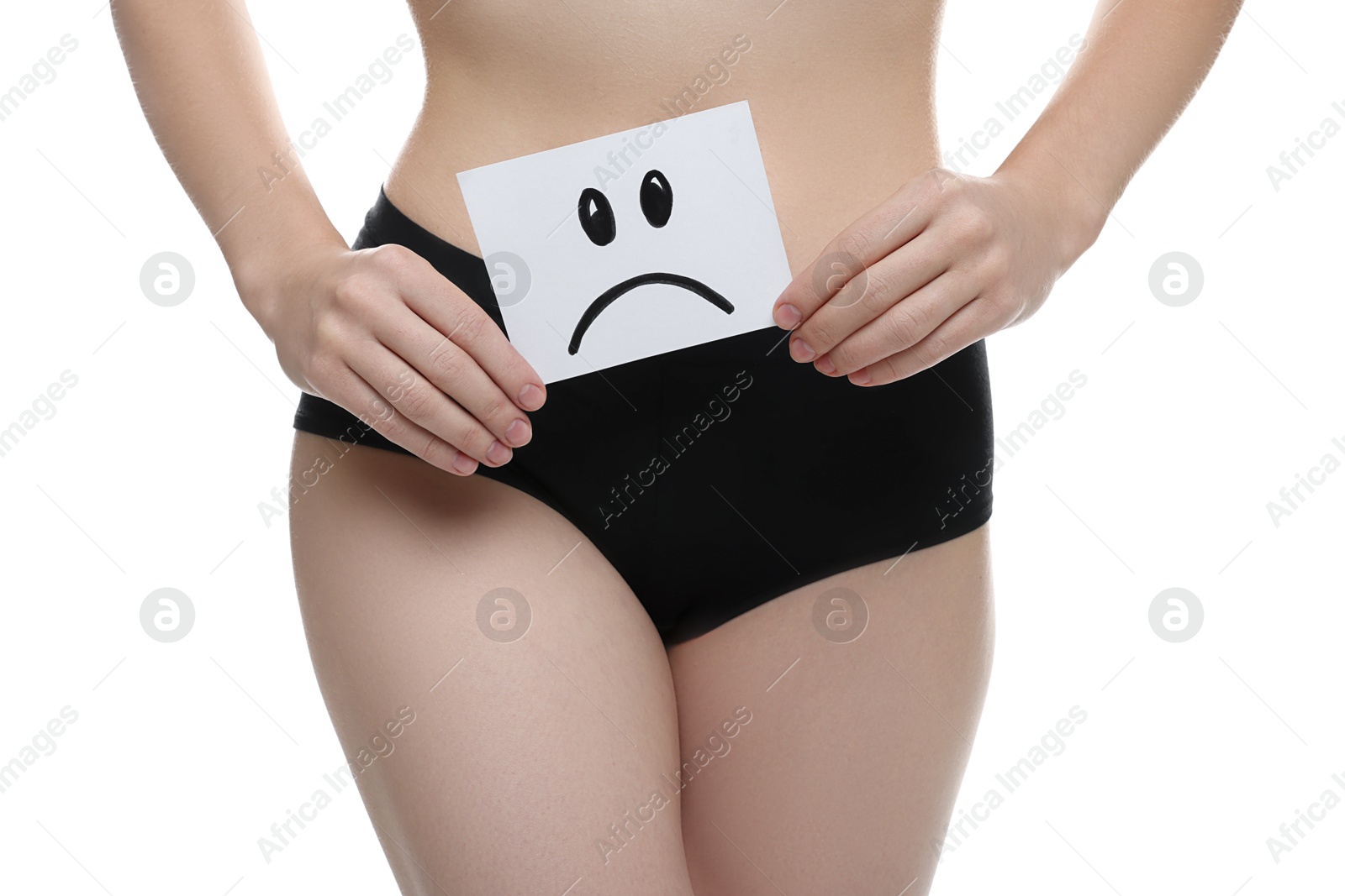 Photo of STD (sexually transmitted disease). Woman holding sticky note with drawn sad face on white background, closeup