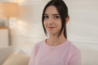 Photo of Portrait of beautiful teenage girl at home