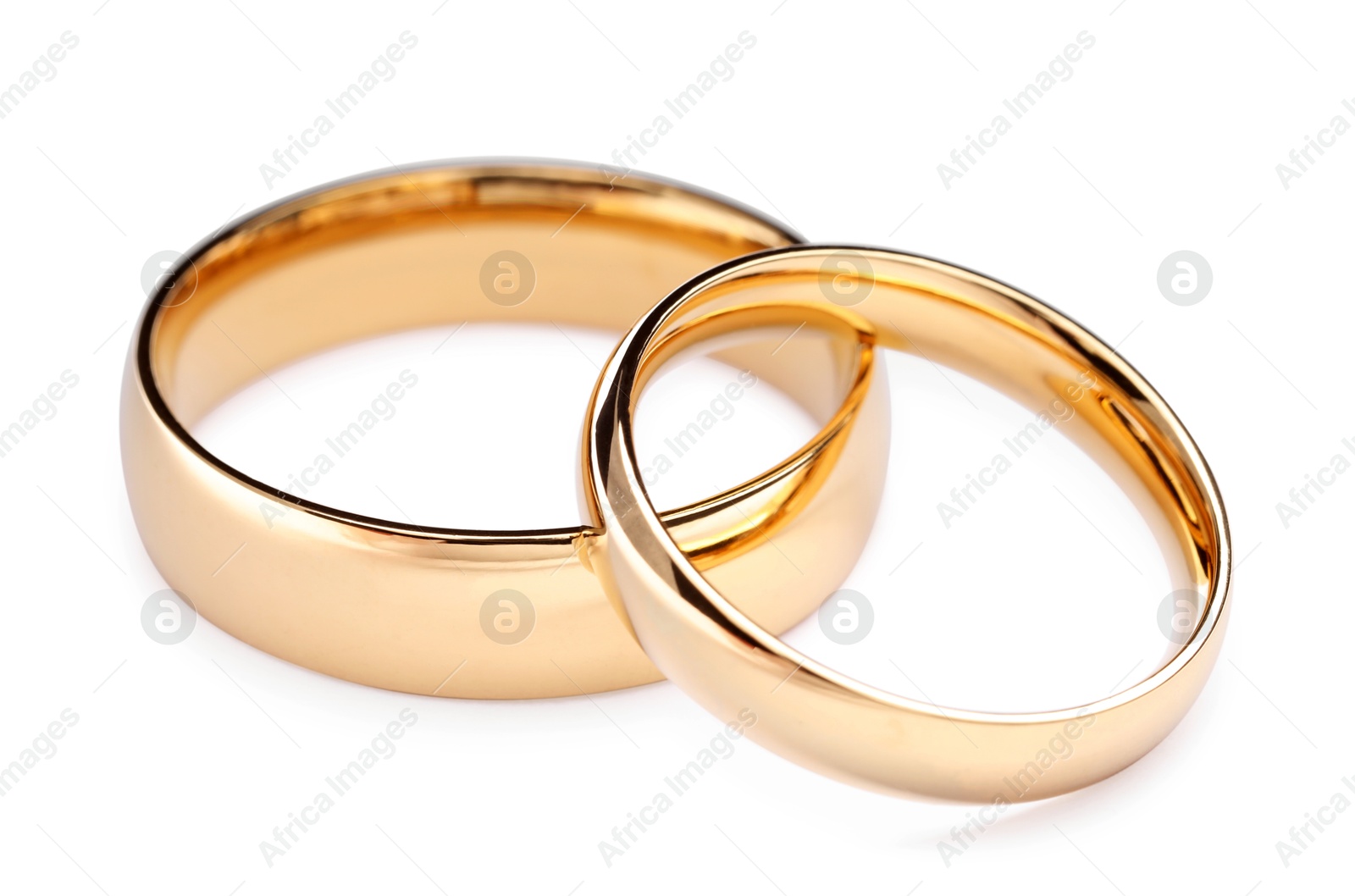 Photo of Beautiful golden wedding rings isolated on white