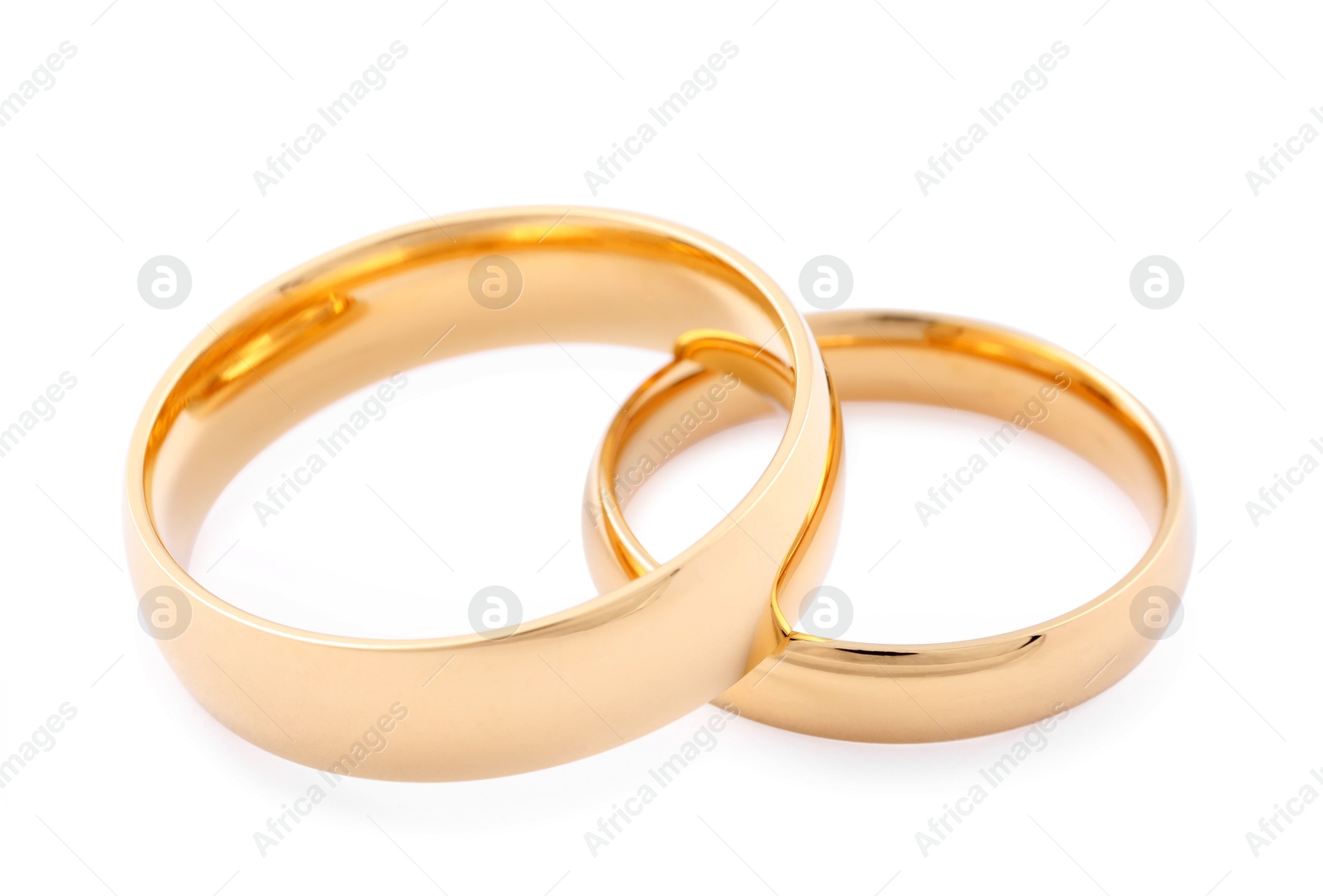 Photo of Beautiful golden wedding rings isolated on white