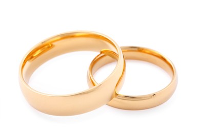 Photo of Beautiful golden wedding rings isolated on white