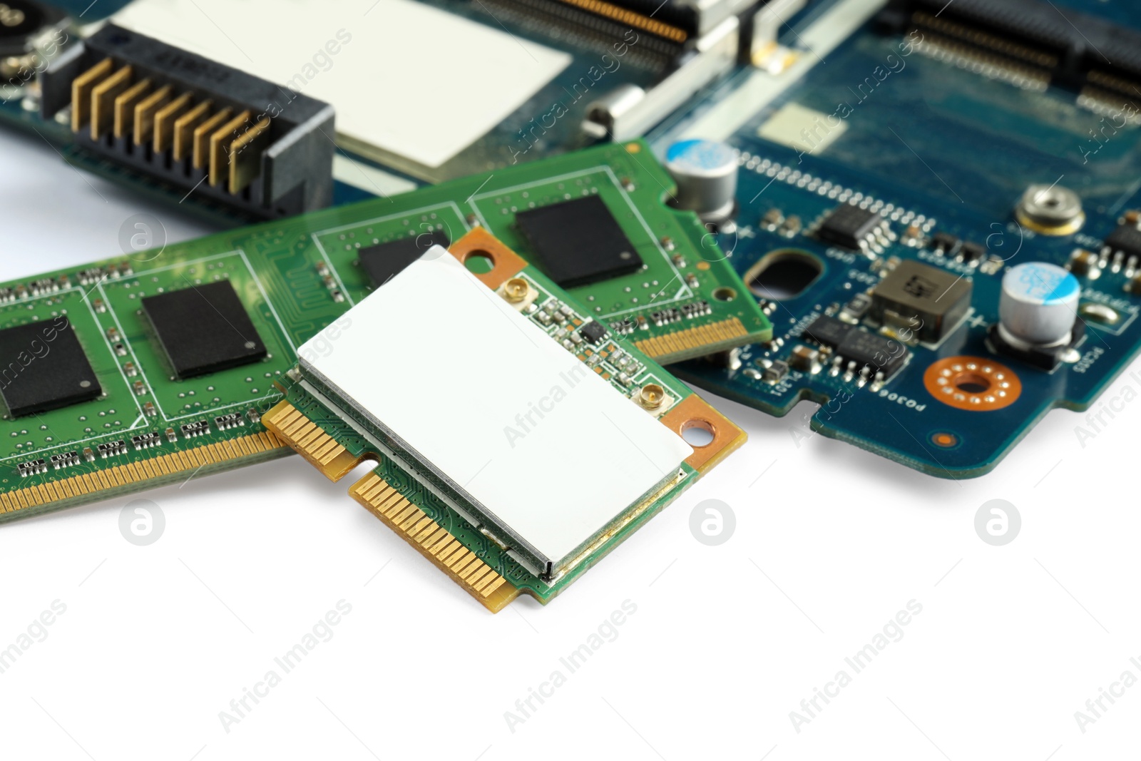 Photo of Wi-Fi card, RAM chip and computer circuit board isolated on white. Electronic engineering