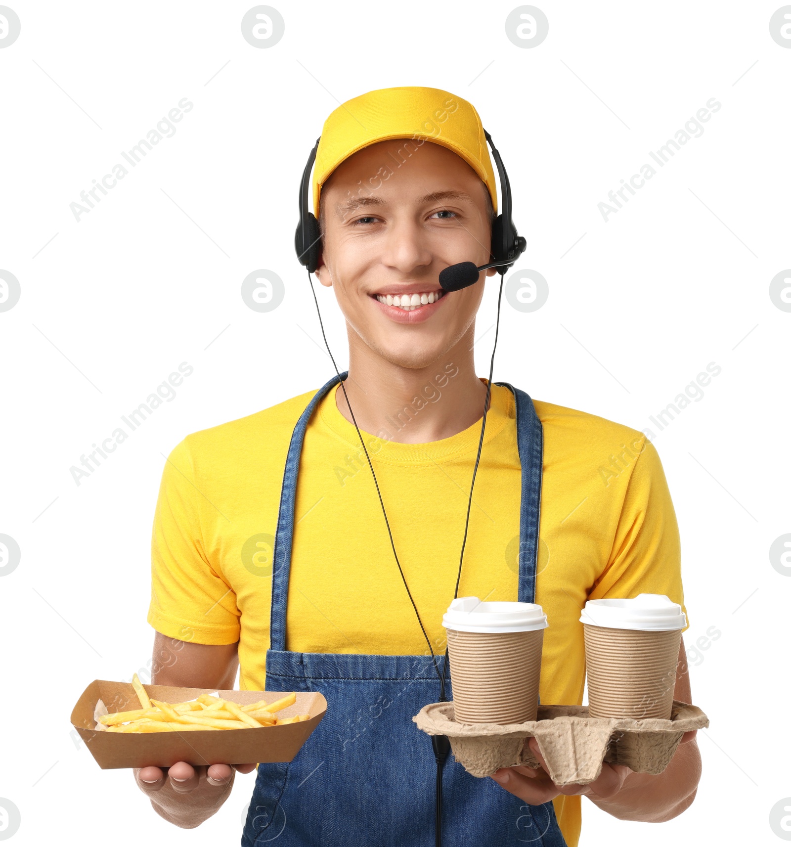 Photo of Fast-food worker holding paper container with French fries and cups on white background