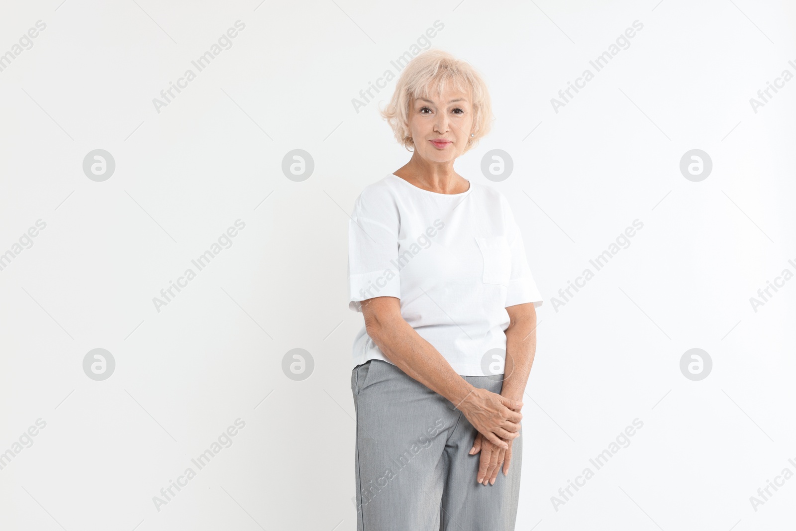 Photo of Portrait of beautiful senior woman on white background