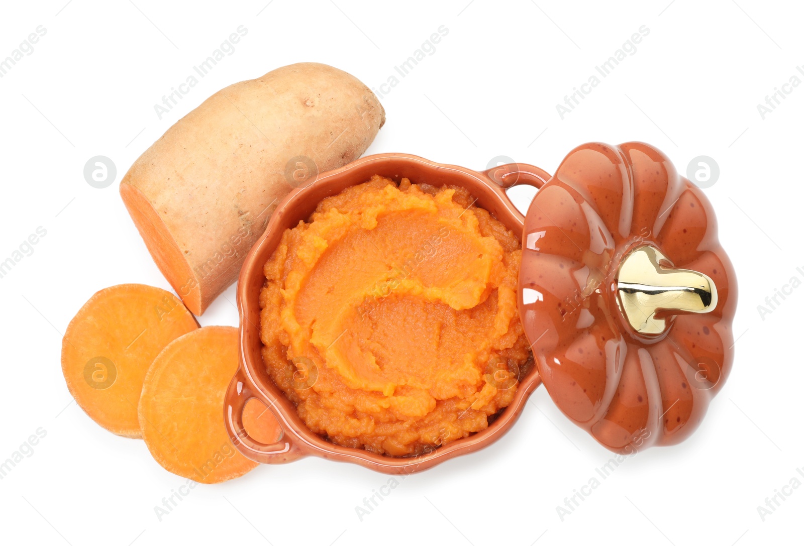 Photo of Tasty mashed sweet potato in pot and cut vegetable isolated on white, top view