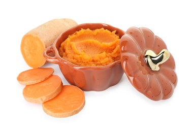 Photo of Tasty mashed sweet potato in pot and cut vegetable isolated on white