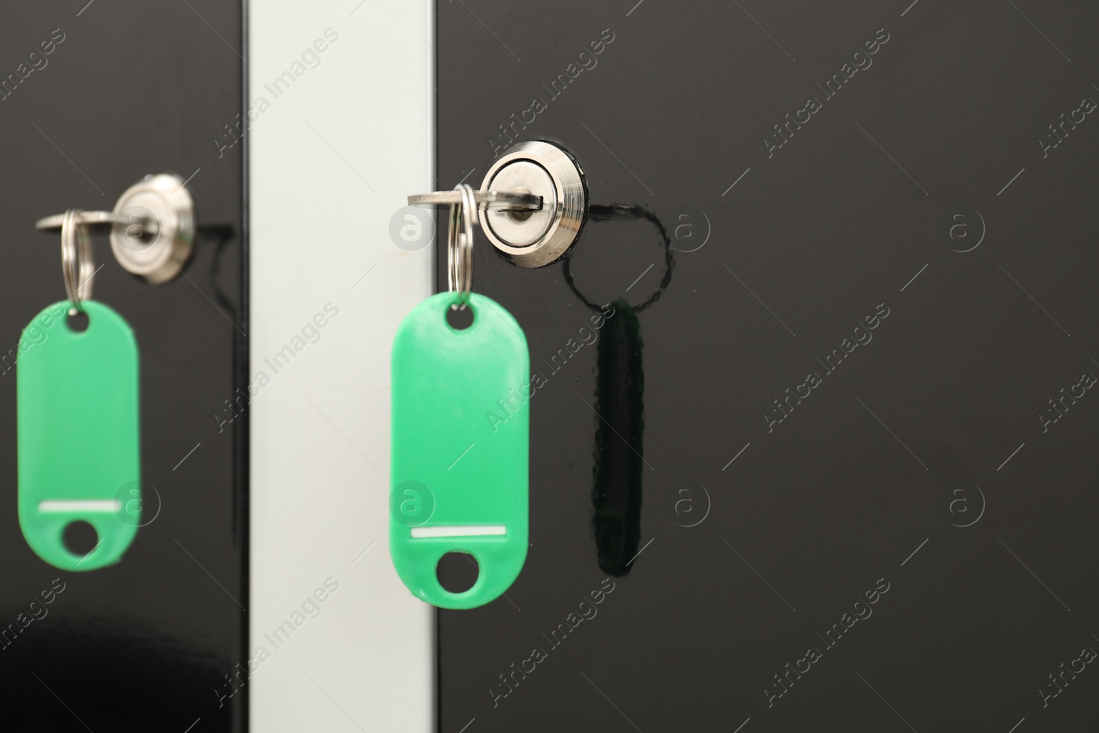 Photo of Modern lockers with bright keys, closeup view