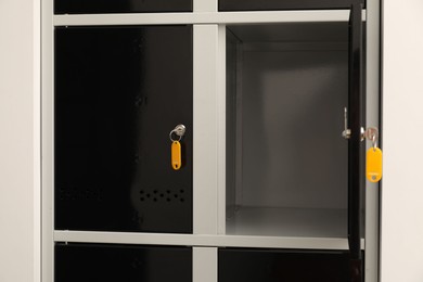 Modern lockers with bright keys indoors, closeup