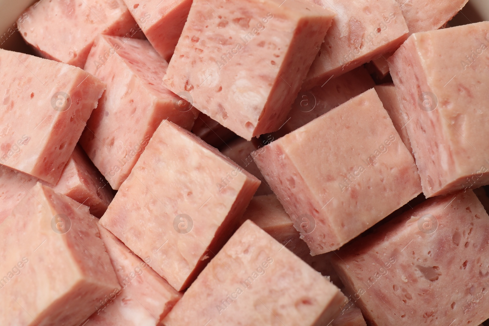 Photo of Pieces of canned meat as background, closeup