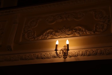 Photo of Vintage lamps on wall in theatre, low angle view