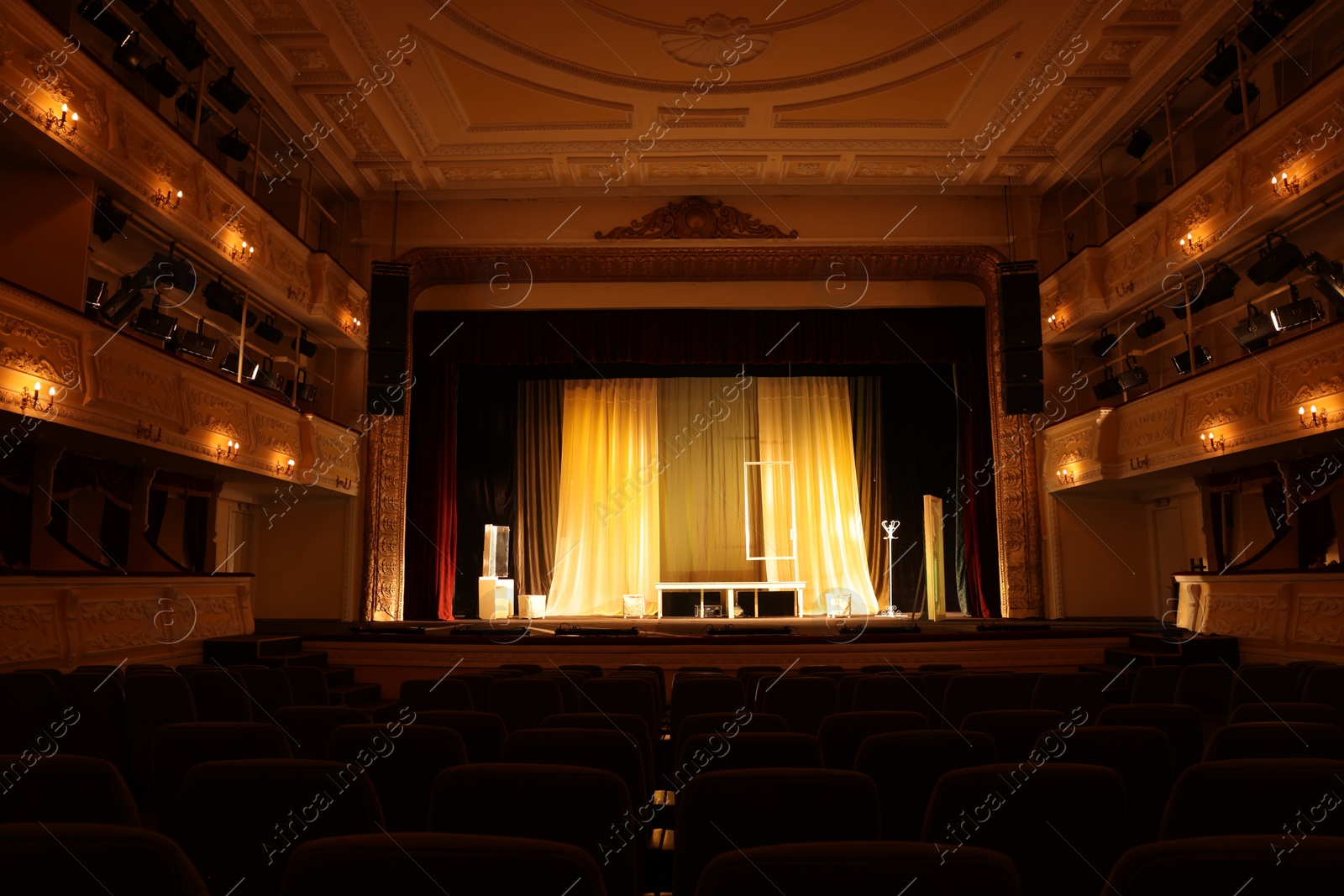 Photo of Different furniture and other decorations on stage in theatre