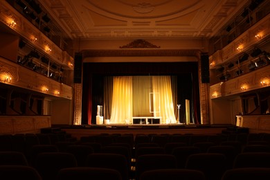 Photo of Different furniture and other decorations on stage in theatre