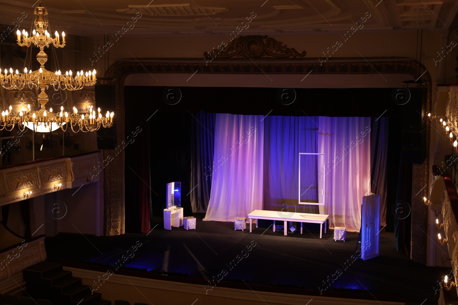 Photo of Theatre interior with stage and beautiful chandelier