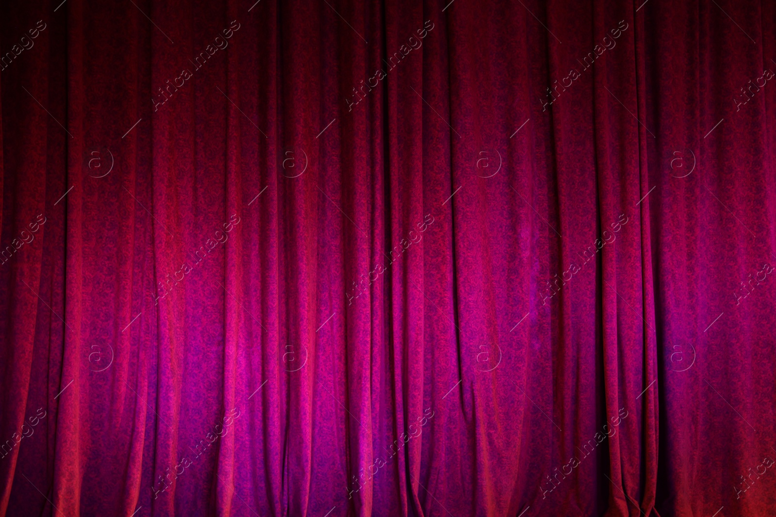 Photo of Elegant bright curtains in theatre as background, closeup