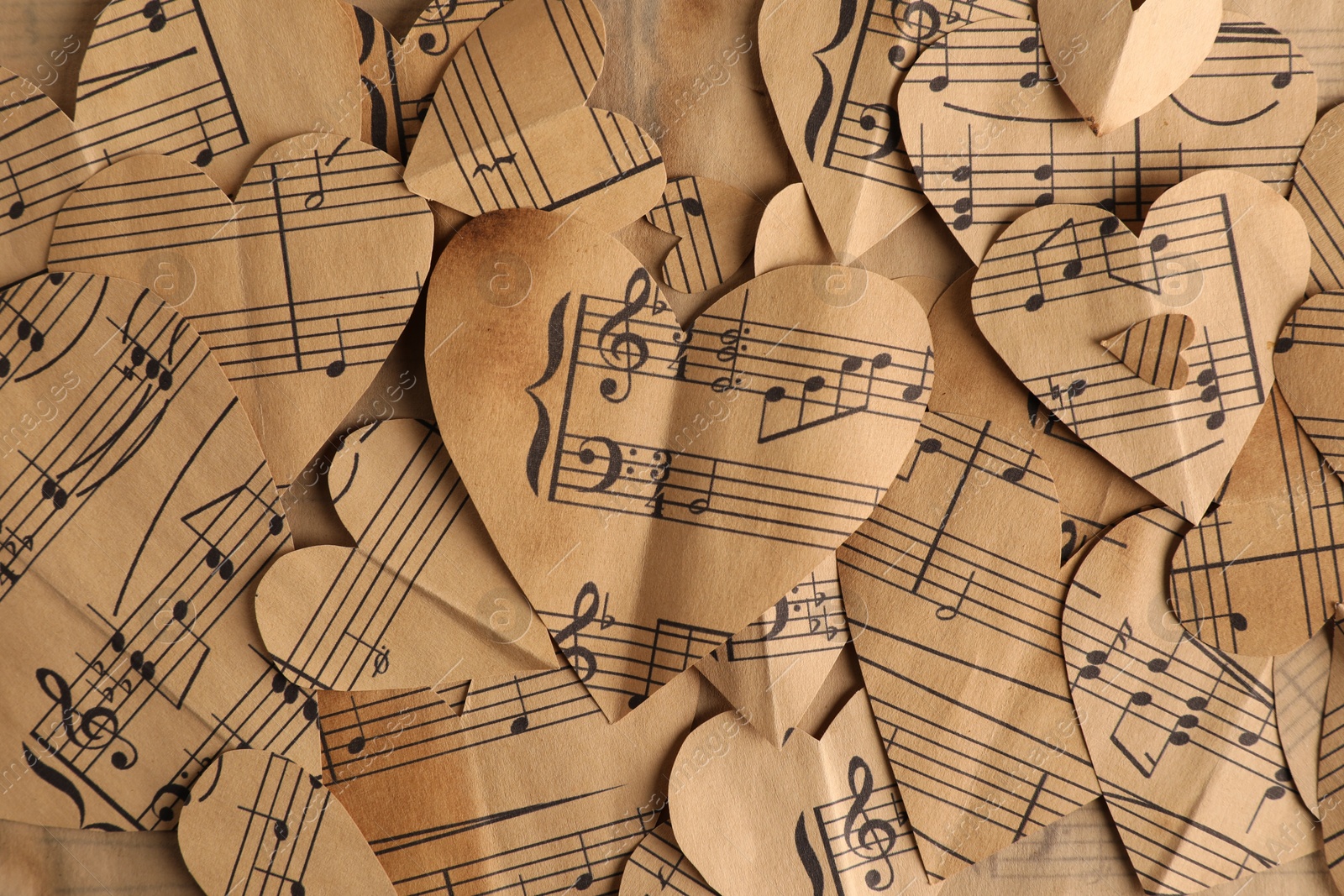 Photo of Paper hearts with notes as background, top view