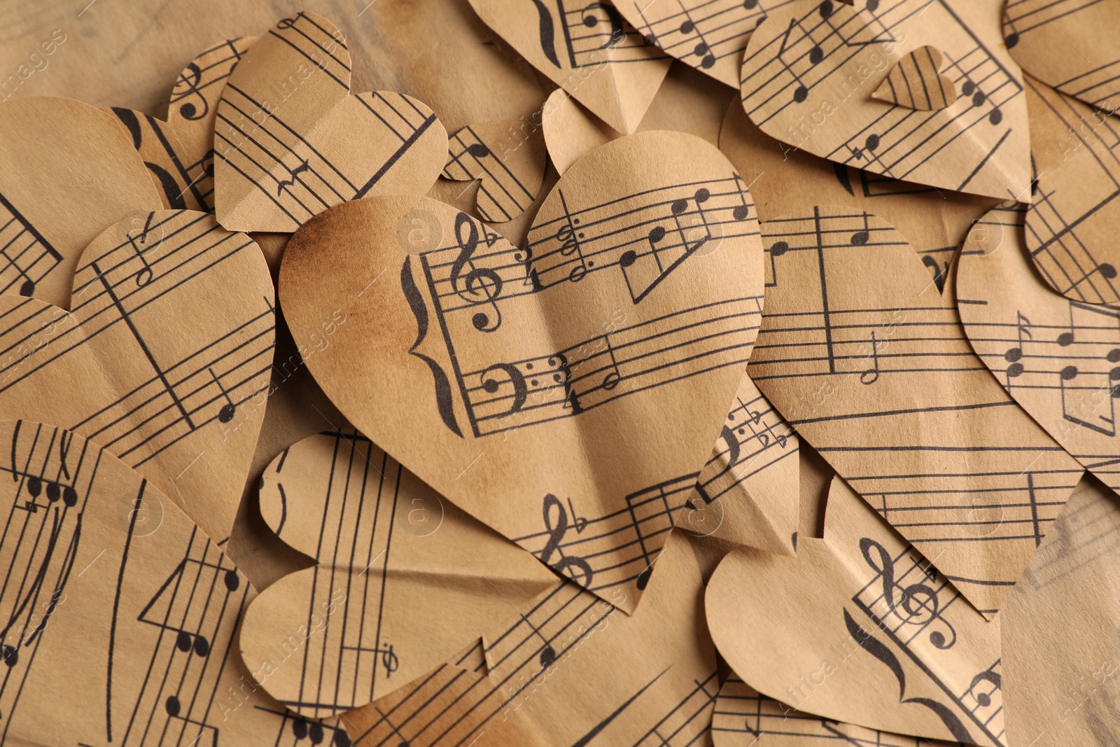 Photo of Paper hearts with notes as background, top view