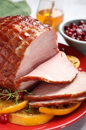 Photo of Tasty baked ham served on white table, closeup