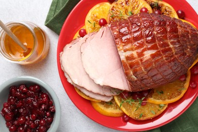 Tasty baked ham served on white table, flat lay