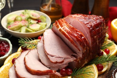 Photo of Tasty baked ham served on table, closeup