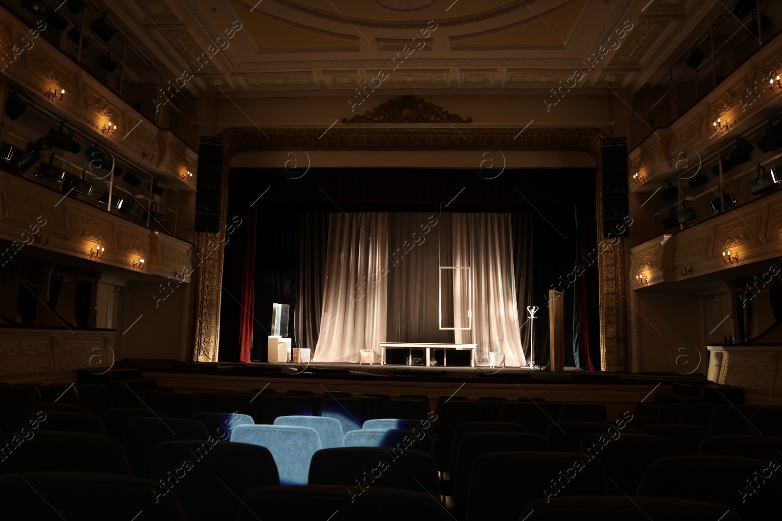 Photo of Theatre interior with stage and rows of comfortable seats