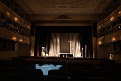 Photo of Theatre interior with stage and rows of comfortable seats