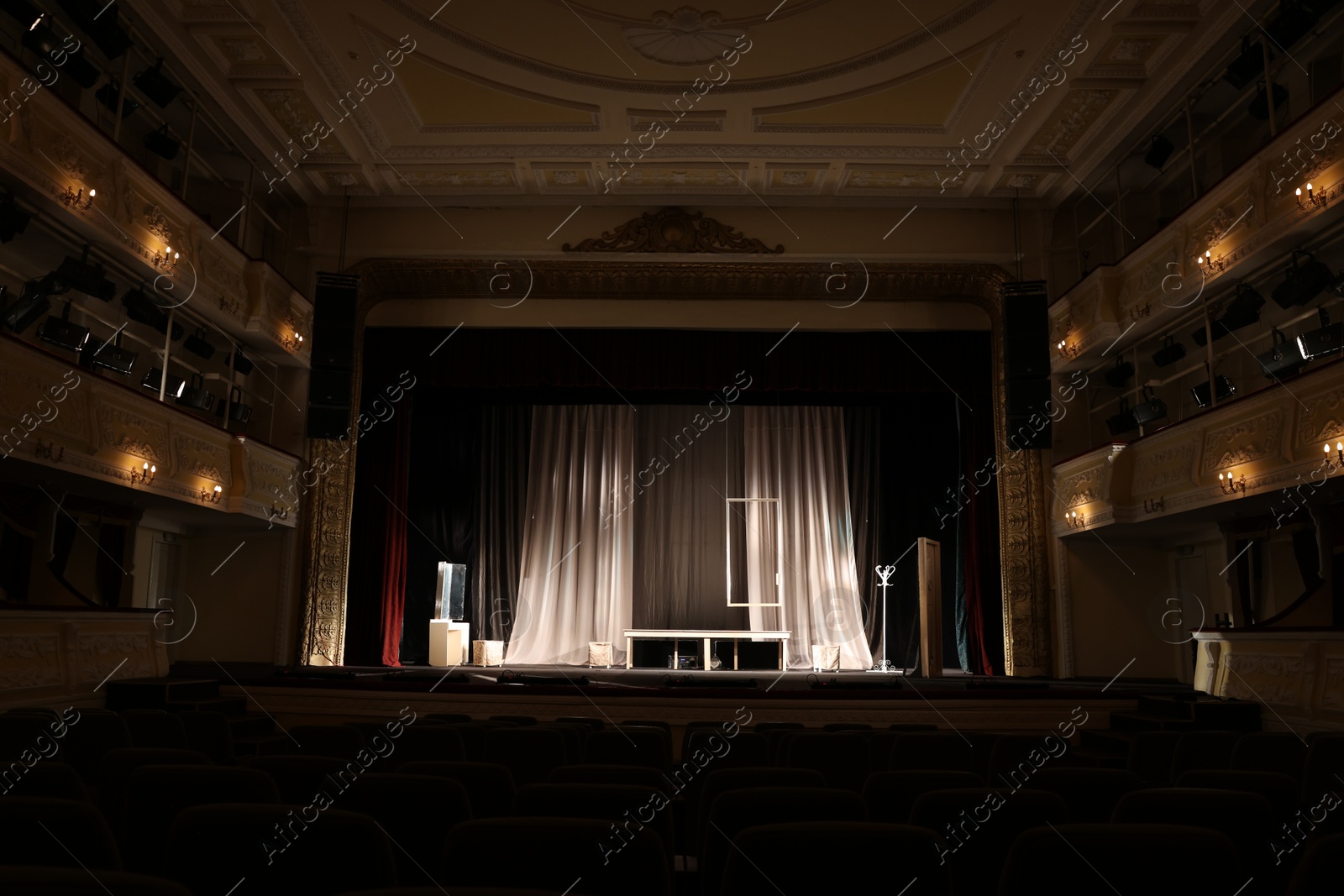 Photo of Different furniture and other decor on stage in theatre