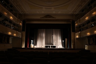 Photo of Different furniture and other decor on stage in theatre