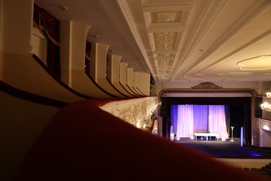 Photo of Different furniture and other decor on stage in theatre