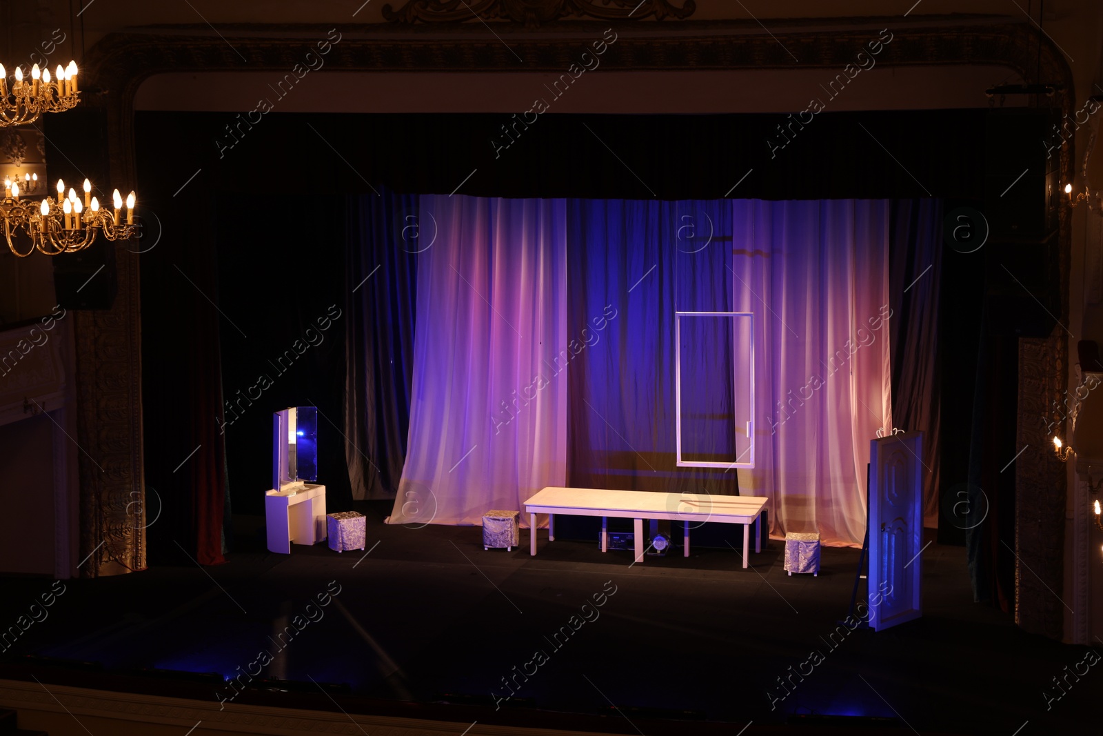 Photo of Different furniture and other decor on stage in theatre