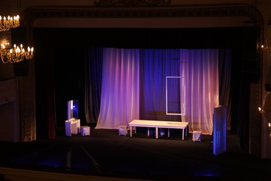 Photo of Different furniture and other decor on stage in theatre