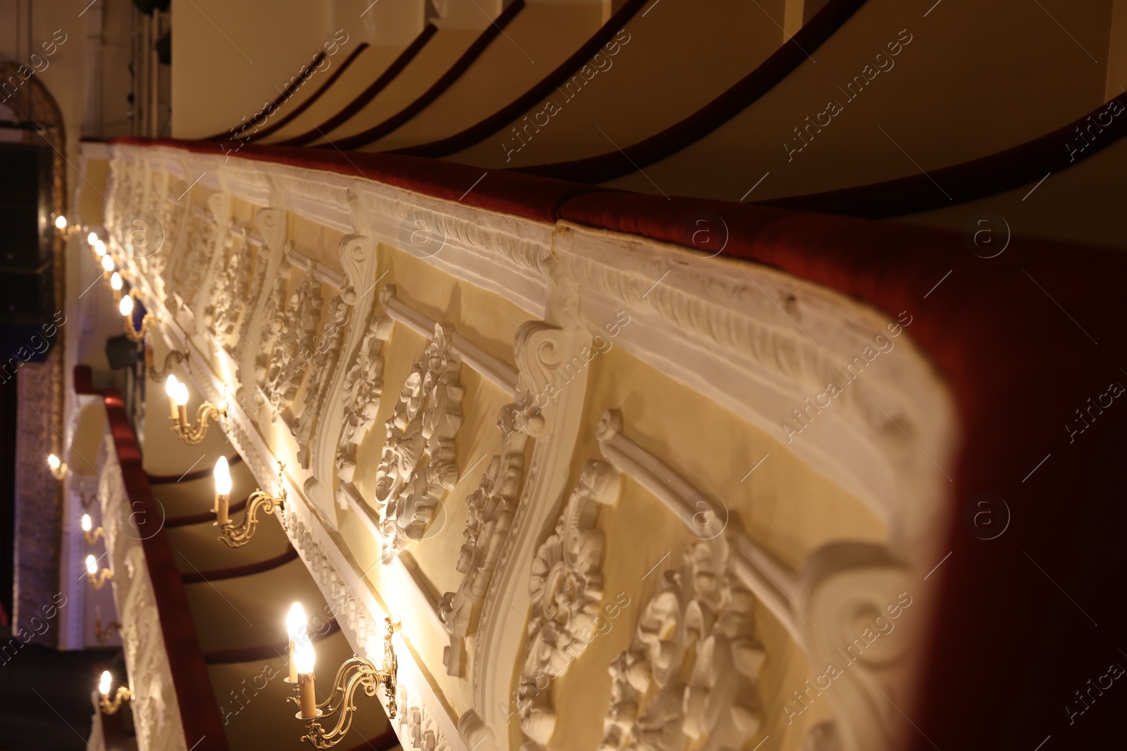 Photo of Vintage lamps on wall in theatre, selective focus