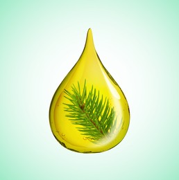 Image of Conifer essential oil drop with pine tree branch inside on light turquoise background