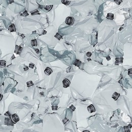 Many used crumpled plastic bottles as background