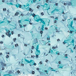 Many used crumpled plastic bottles as background