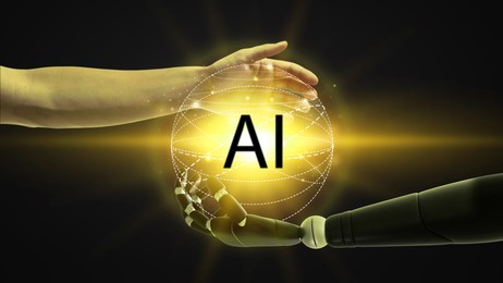 Image of AI abbreviation between human hand and robot arm on black background. Banner design