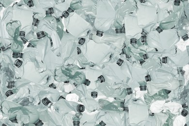 Many used crumpled plastic bottles as background