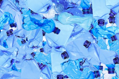 Many used crumpled plastic bottles as background