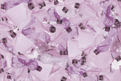 Many used crumpled plastic bottles as background