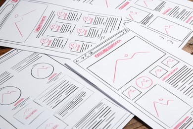 Developing UI design. Sketches of website wireframes on table, closeup