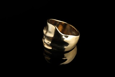 Beautiful bijouterie. Stylish ring on black background