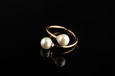 Beautiful bijouterie. Stylish ring on black background