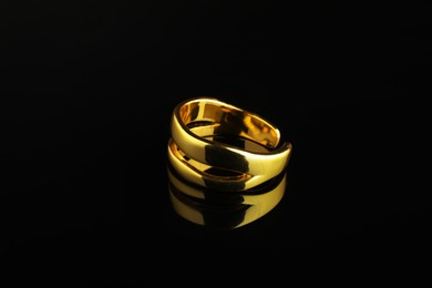 Photo of Beautiful bijouterie. Stylish ring on black background