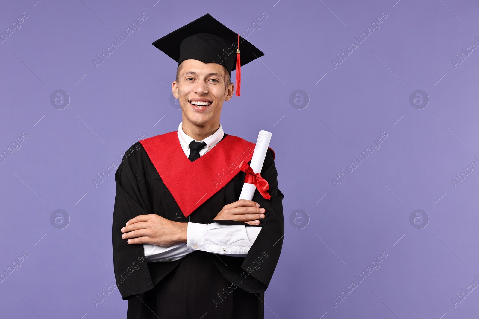 Photo of Happy student with diploma after graduation on violet background. Space for text